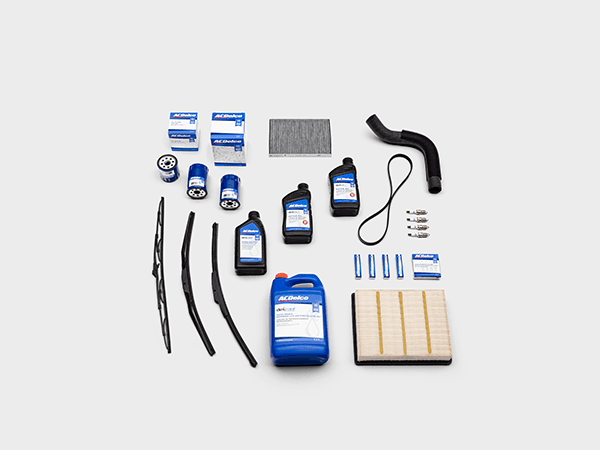 Genuine OEM Cadillac Parts by AC Delco laid out on a white background