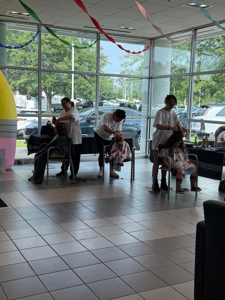 Cost Cutters stylists providing free back-to-school haircuts to local students in McHenry