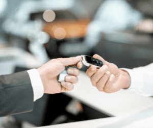 First time car buyer receiving vehicle keys