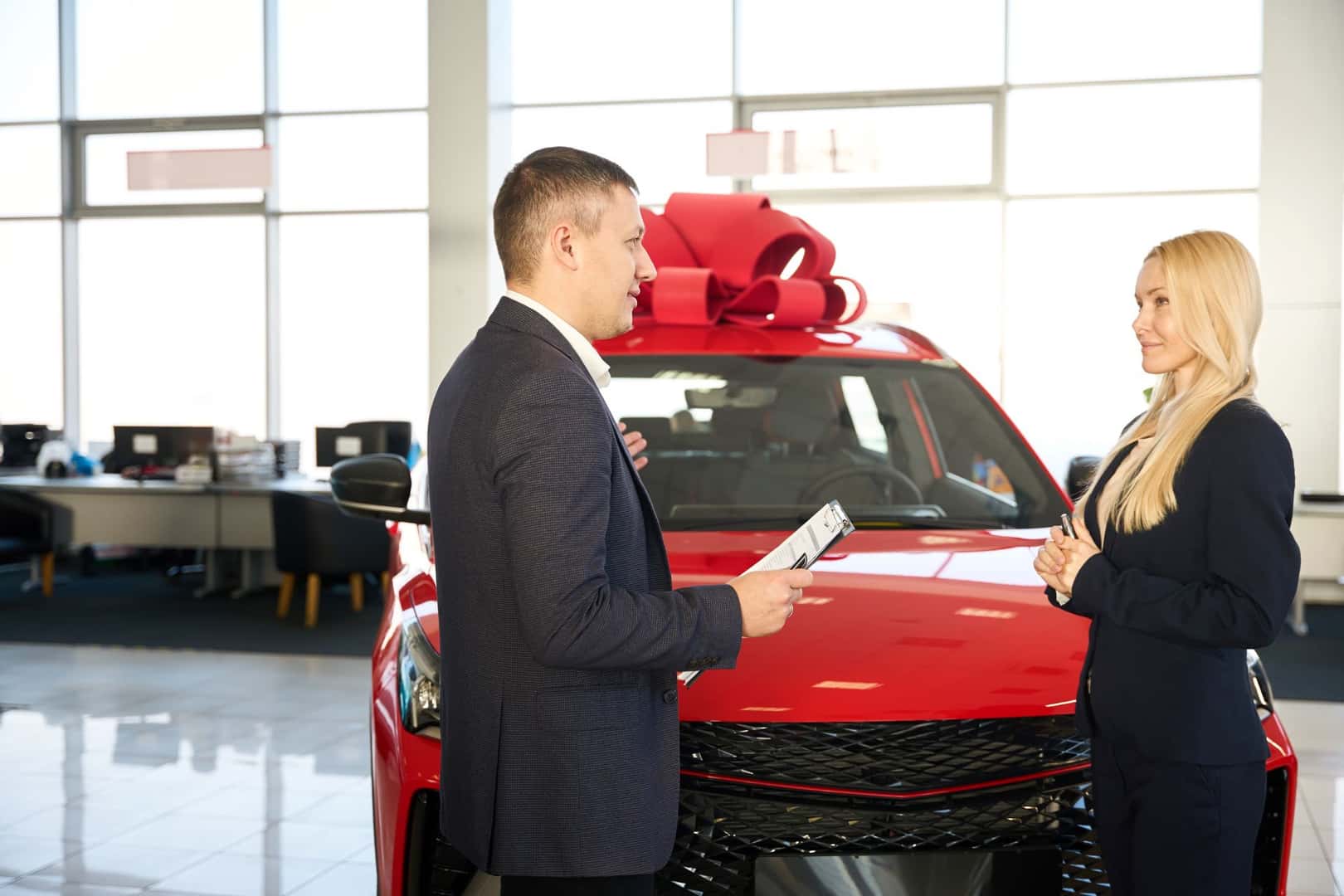 Car Dealer Discussing With Customer