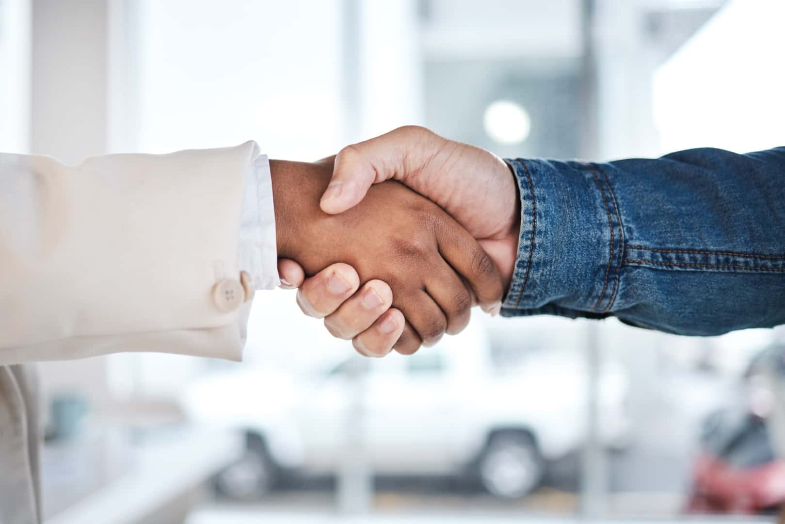 People trading keys/Shaking hands