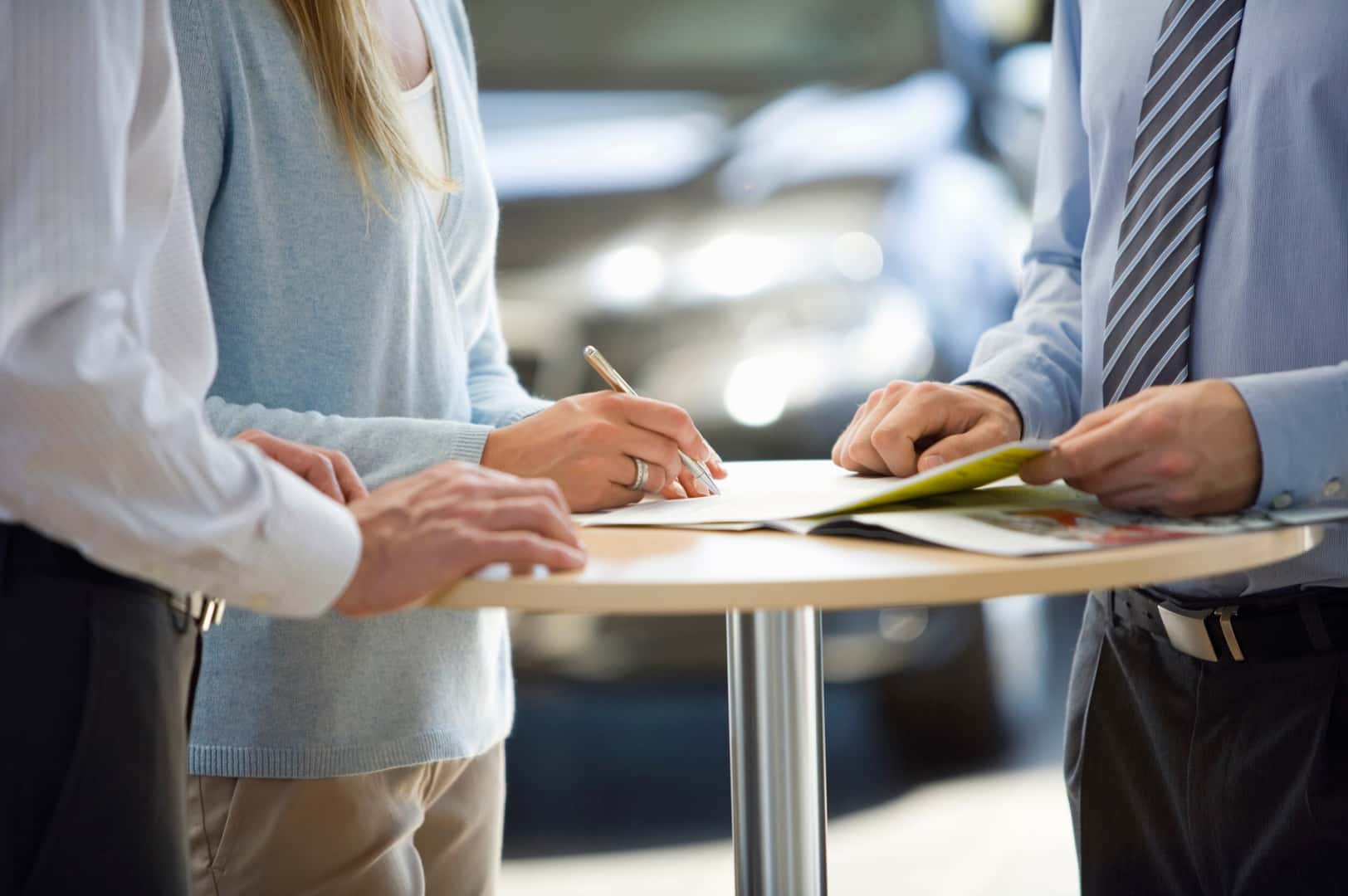 People signing contracts