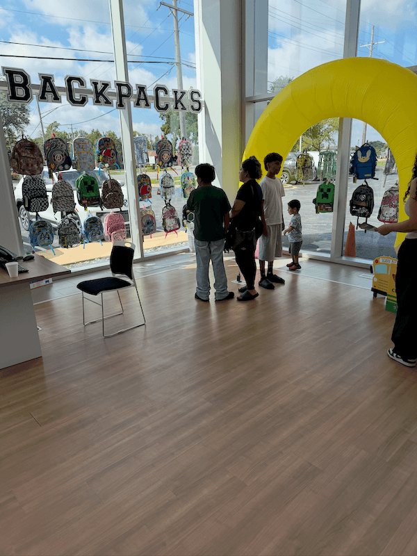 Backpacks displayed for local students at the Castle Hyundai Downers Grove Back to School Pit Stop