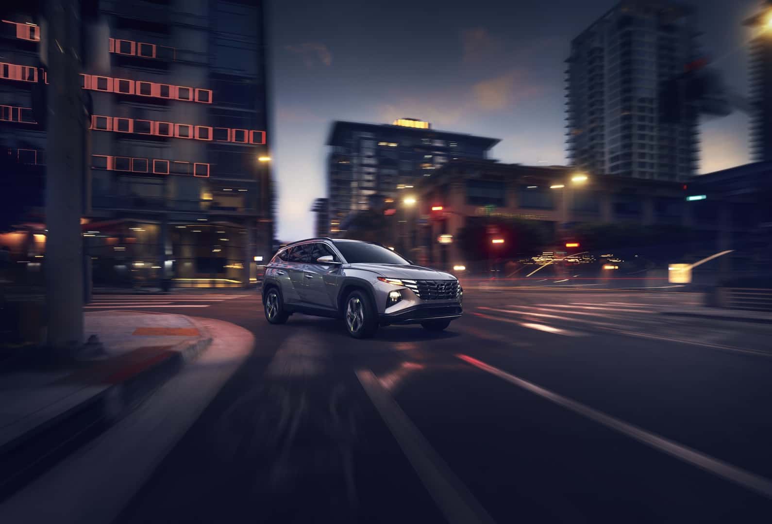 Hyundai Tuscon Driving On City Road
