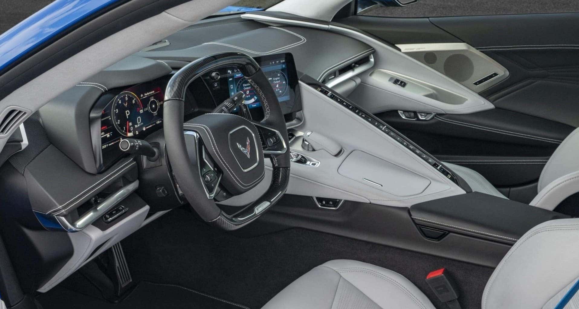  Luxurious 2025 Chevrolet Corvette E-Ray interior featuring a driver-focused cockpit, carbon fiber steering wheel, and premium leather seats. Available at Castle Rock Chevy.