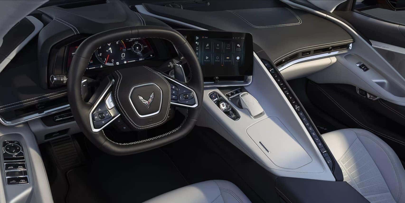 Luxurious 2025 Chevrolet Corvette Stingray interior featuring a leather-wrapped steering wheel, digital instrument cluster, and advanced infotainment system. Available at Castle Rock Chevy.