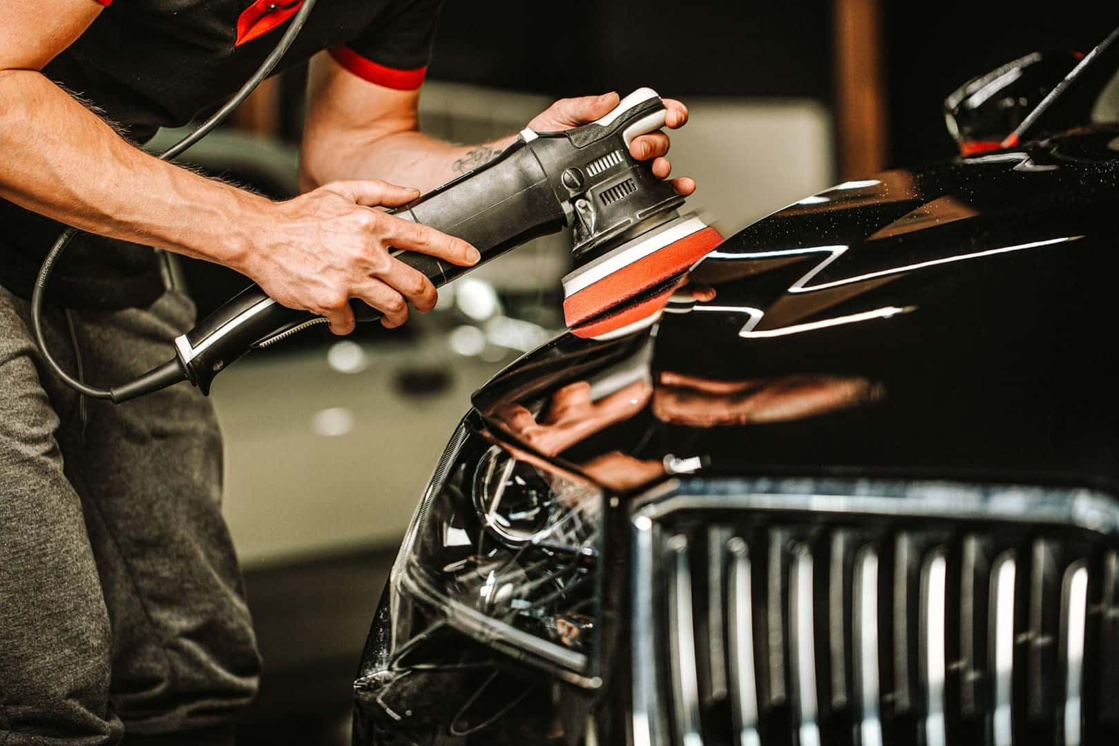 person polishing vehicle