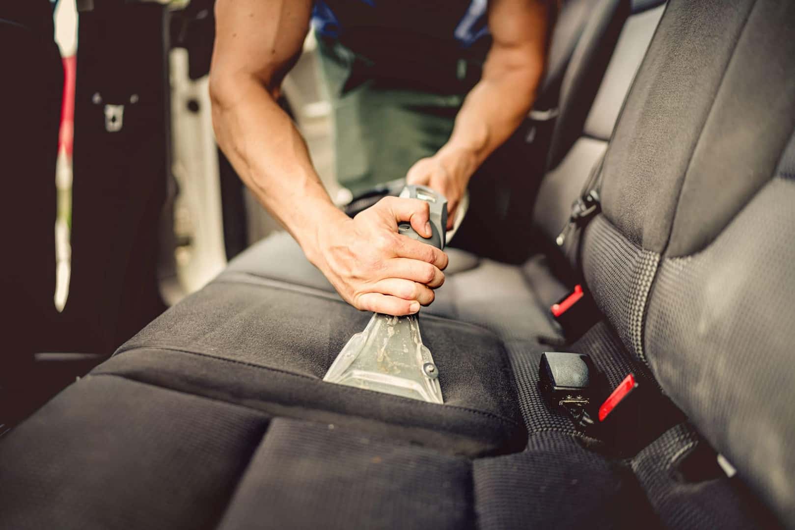 person vacuuming cabin