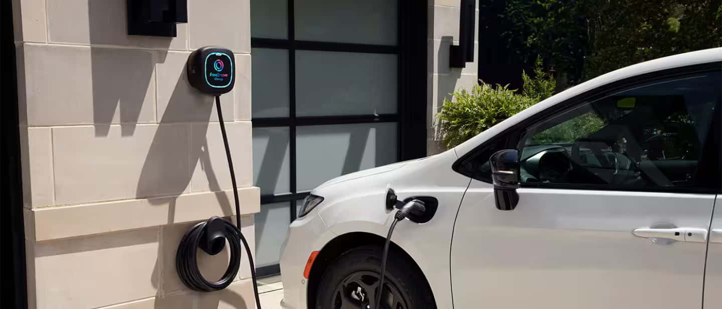 2026 Chrysler Pacifica Plug-In Hybrid plugged in at house
