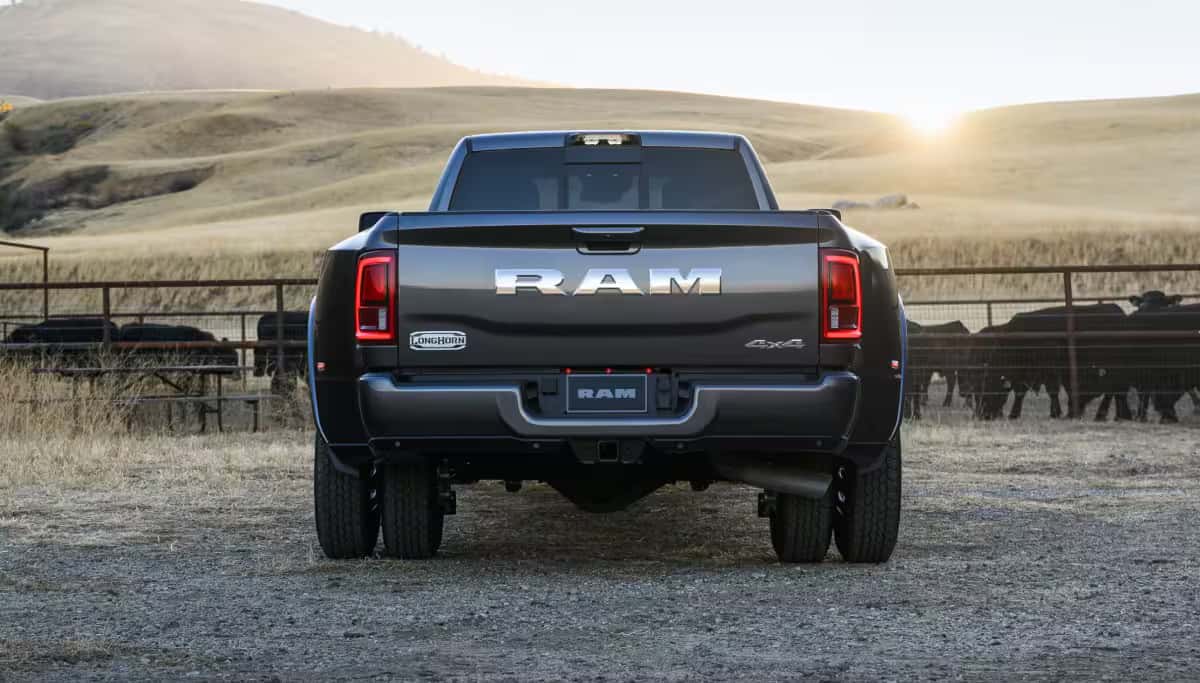 grey 2026 Ram 3500 parked next to cattle