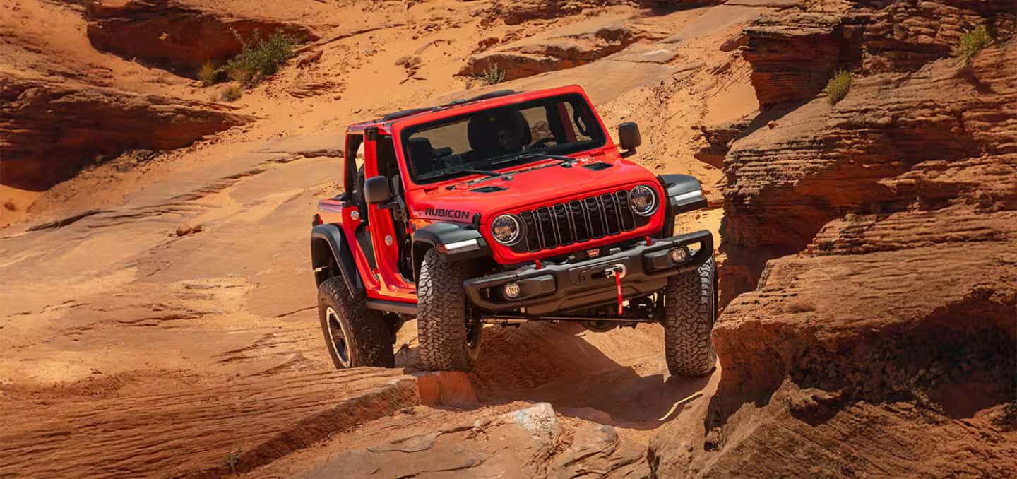 2026 Jeep Wrangler climbing rock