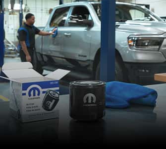 service man working on a ram truck