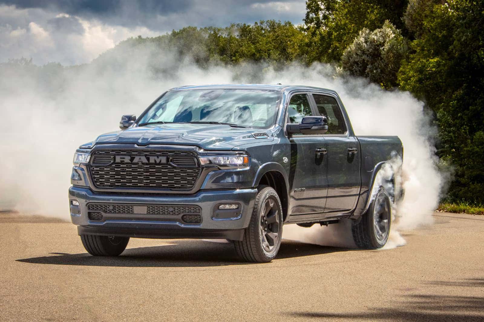 a 2026 Ram 1500 parked with smoking tires
