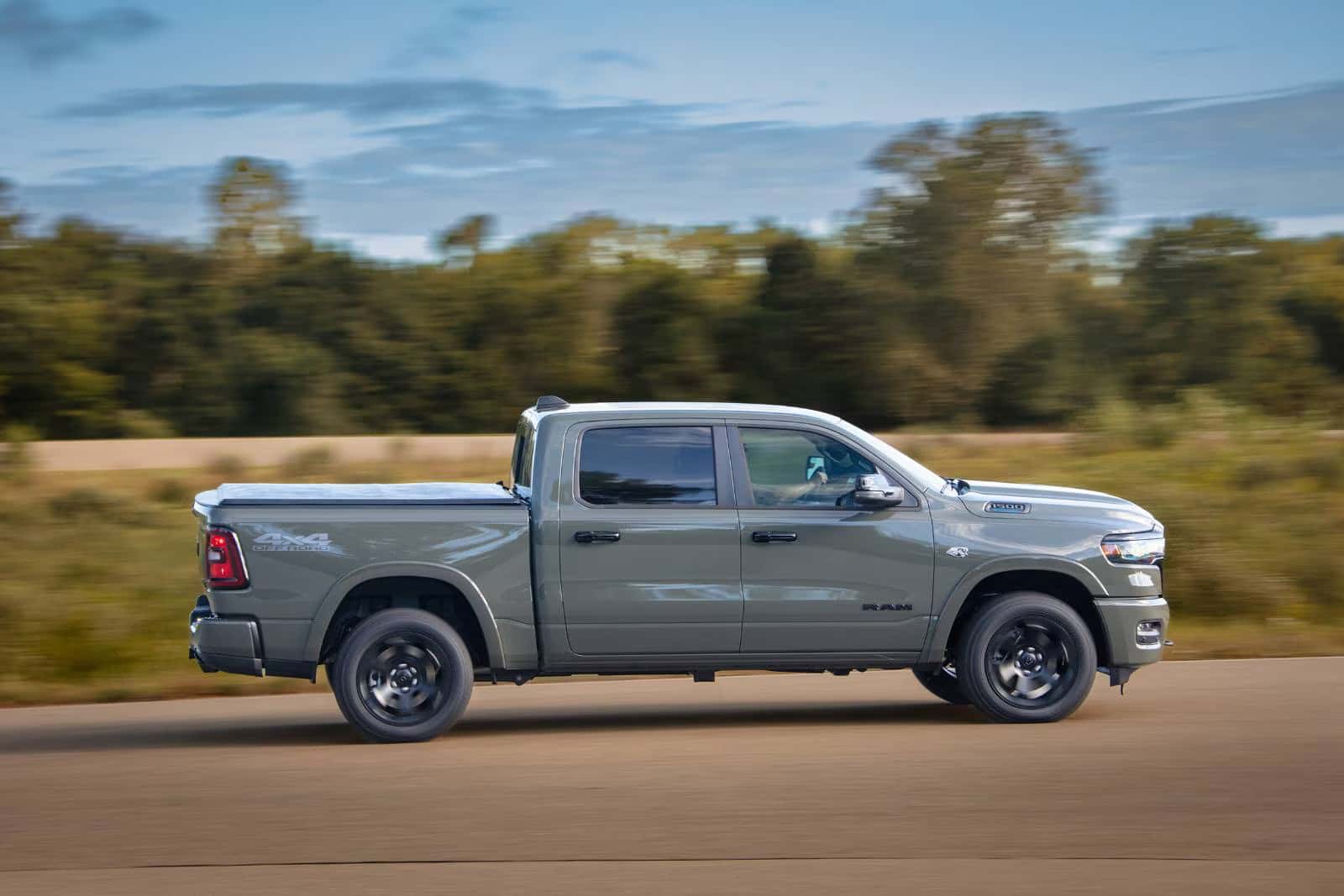 a 2026 Ram 1500 driving on a road