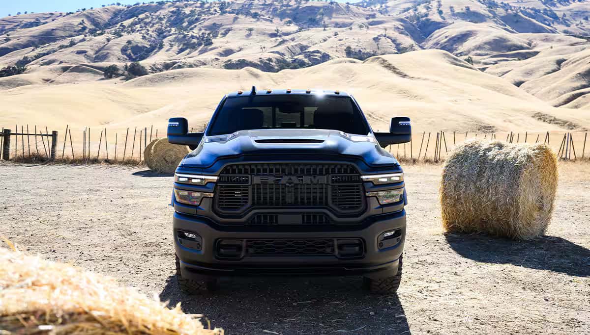 a view of the front grille on a 2026 Ram 2500 parked in a field