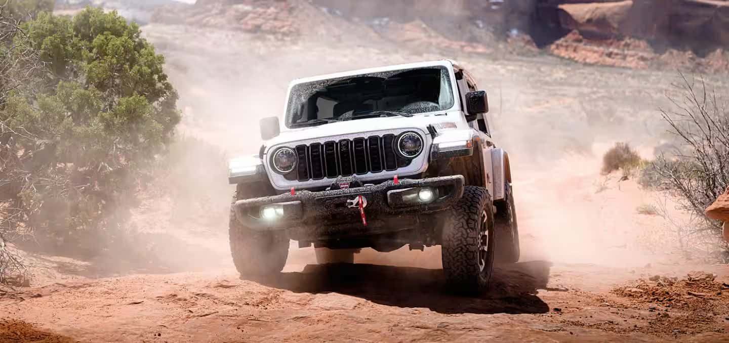 a 2026 Jeep Wrangler driving in the desert