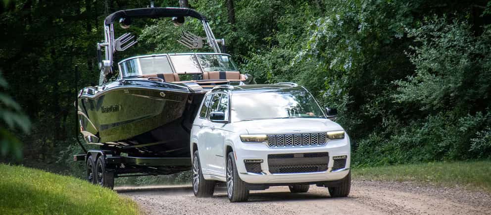 2026 Jeep Grand Cherokee towing a boat