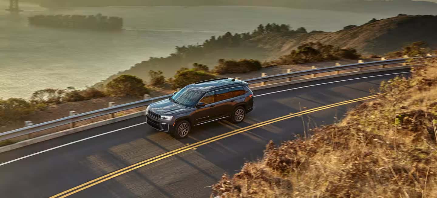 2026 Jeep Grand Cherokee driving on a road