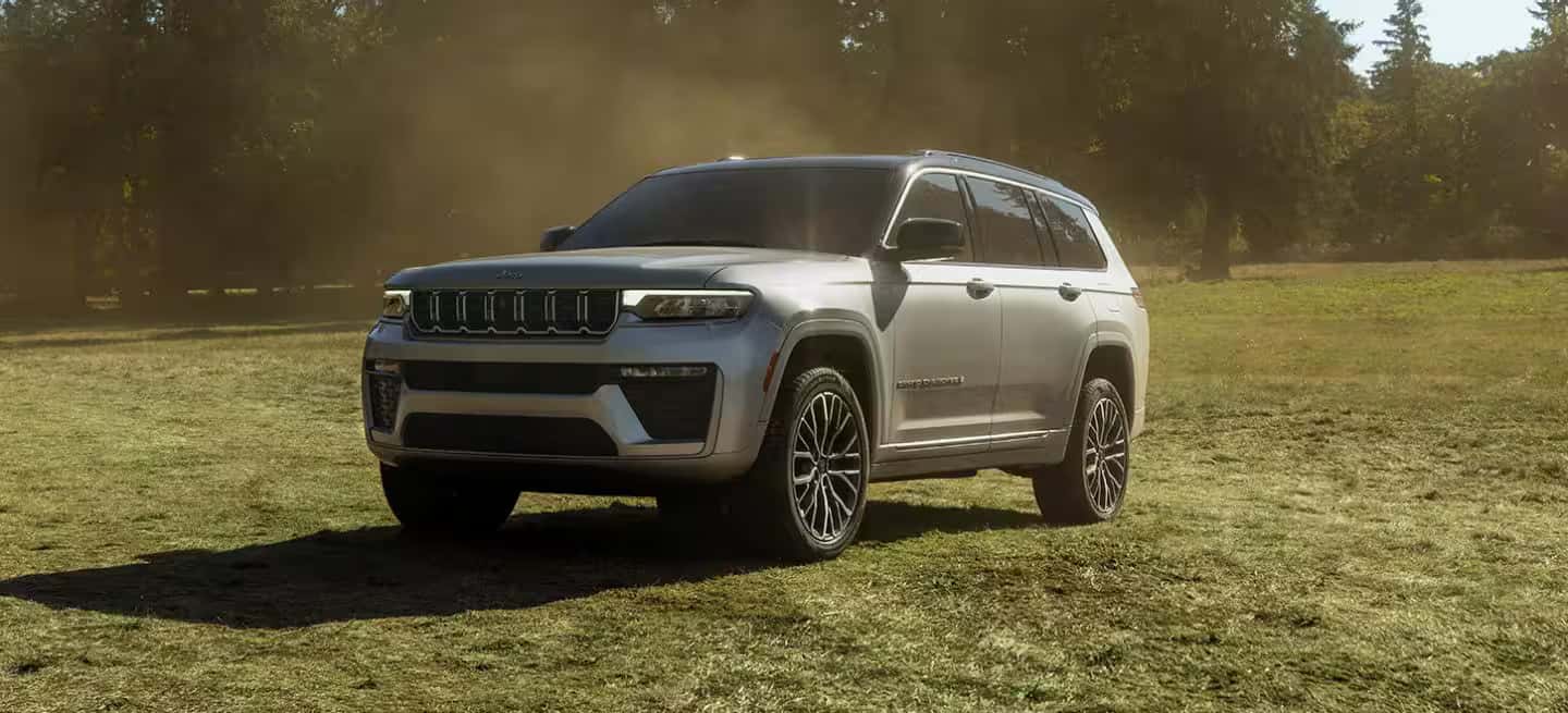2026 Jeep Grand Cherokee Driving through a field