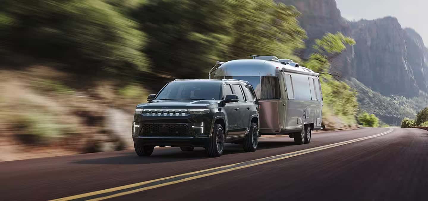 2026 Jeep Grand Wagoneer hauling a camper