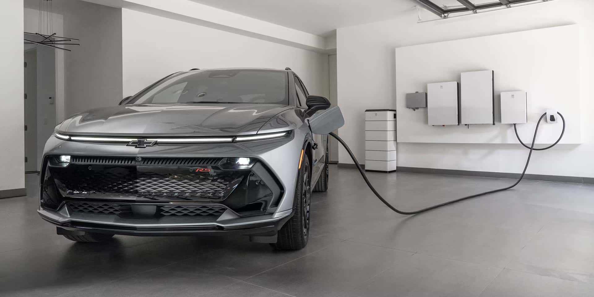2026 Chevy Equinox EV plugged into a charger