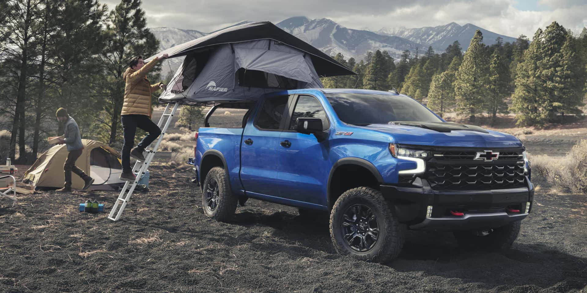 2026 Chevy Silverado 1500 parked in a tent made in the bed of the truck