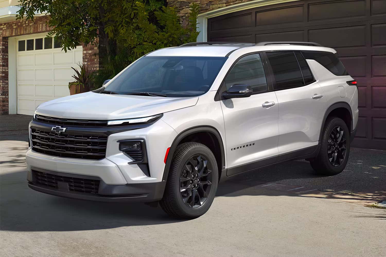 2026 Chevy Traverse parked in front of a home