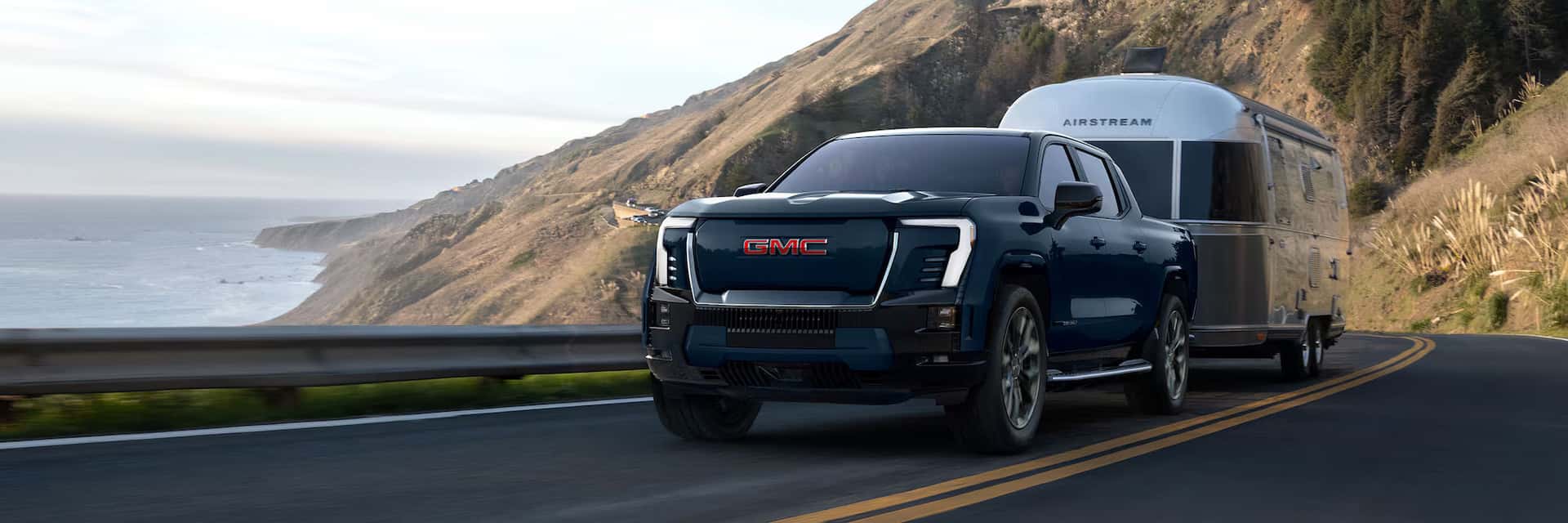 2026 Sierra EV towing a boat