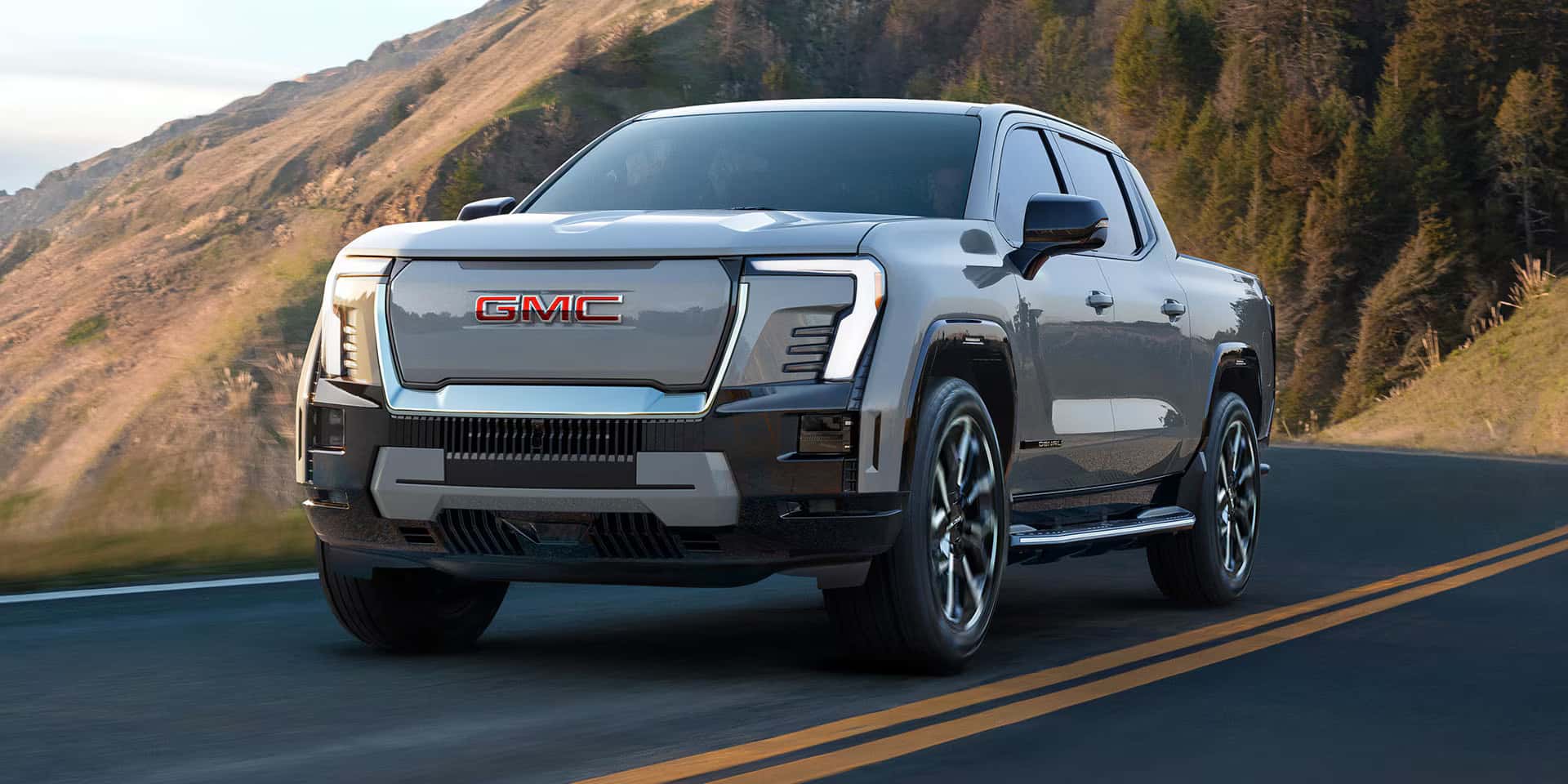 2026 GMC Sierra EV driving on a road