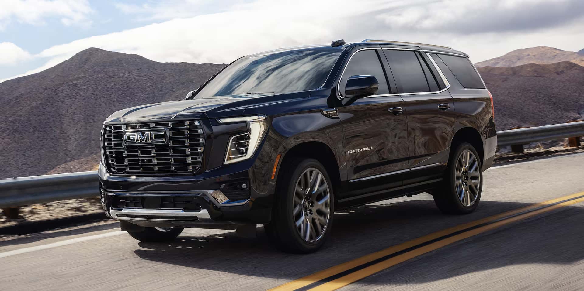 2026 GMC Yukon driving on a road