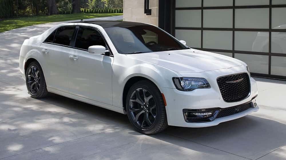 white 2021 chrysler 300 font and side view parked