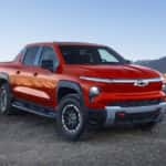 2026 Chevy Silverado EV traversing through sandy terrain