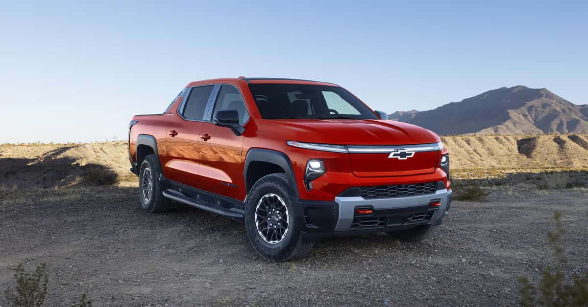 2026 Chevy Silverado EV traversing through sandy terrain