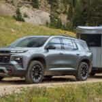 2026 Chevy Traverse hauling a small trailer off-road