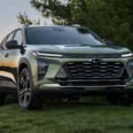 2026 Chevy Trax parked in a scenic natural landscape with trees in the background
