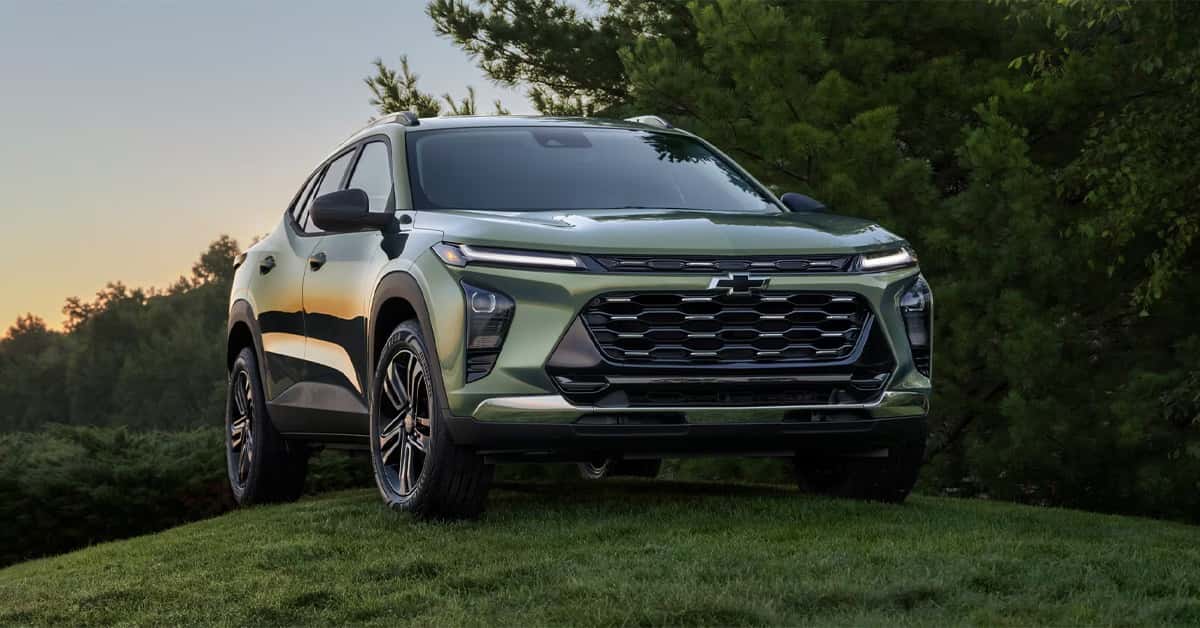 2026 Chevy Trax parked in a scenic natural landscape with trees in the background