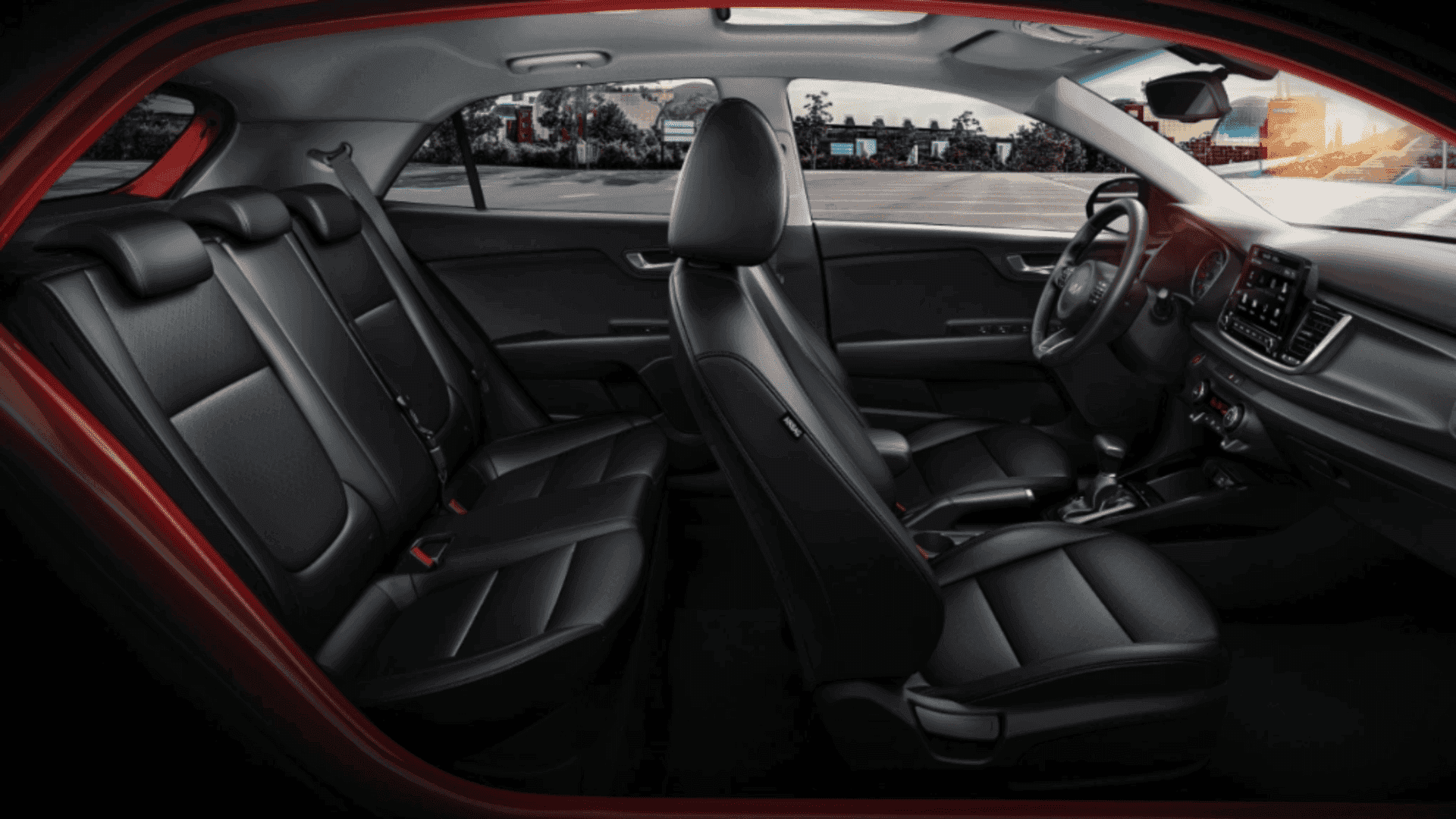 Full side interior of 2023 Kia Rio showcasing both front and rear seats