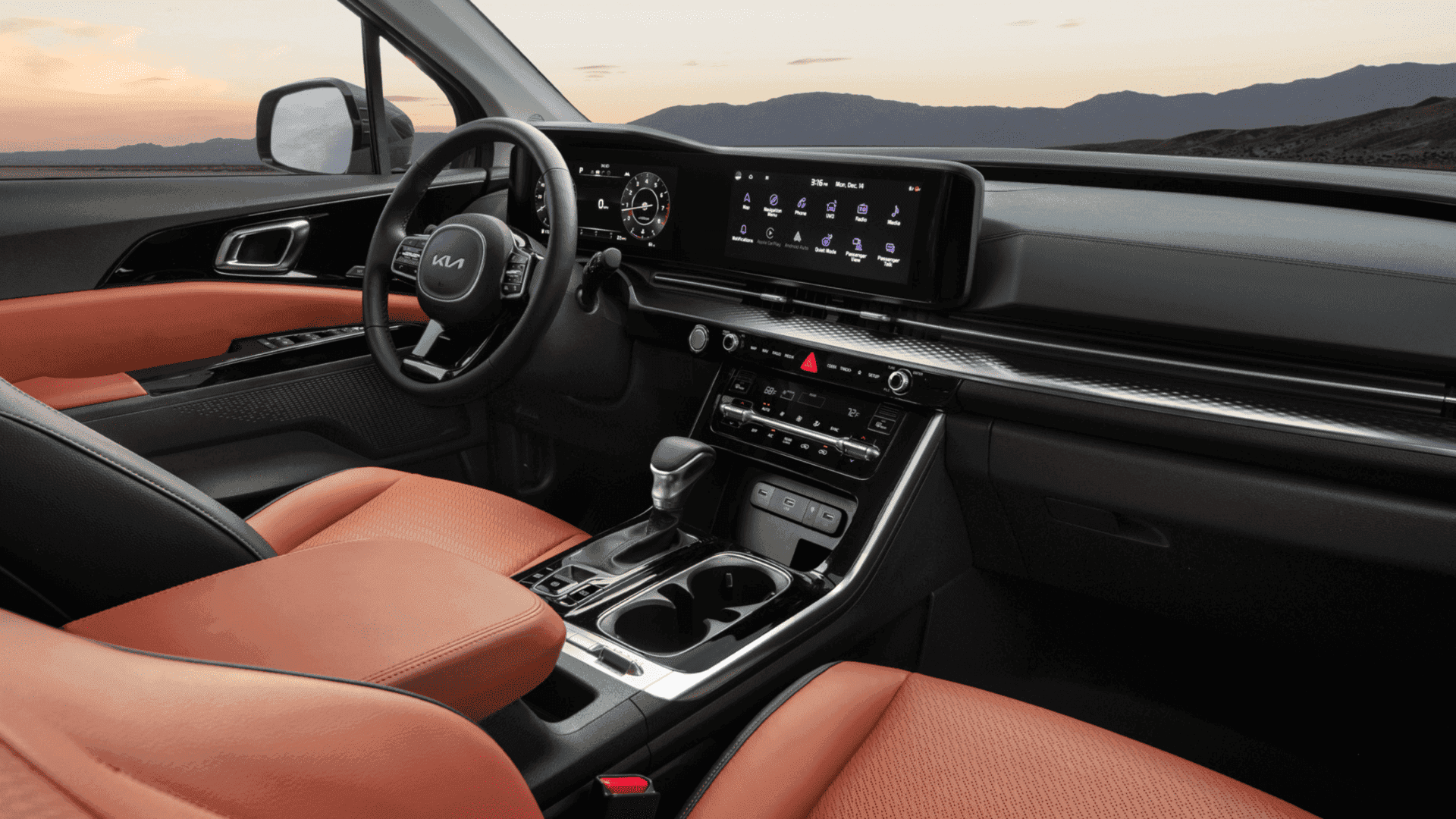 Two-tone interior of Kia Carnival showcasing dashboard and infotainment screen