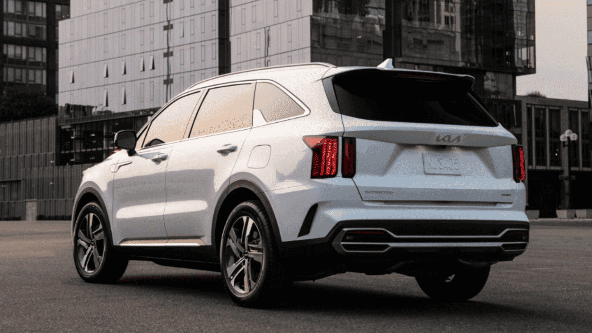 Rear view of the 2024 Kia Sorento Plug-In Hybrid parked in an urban setting