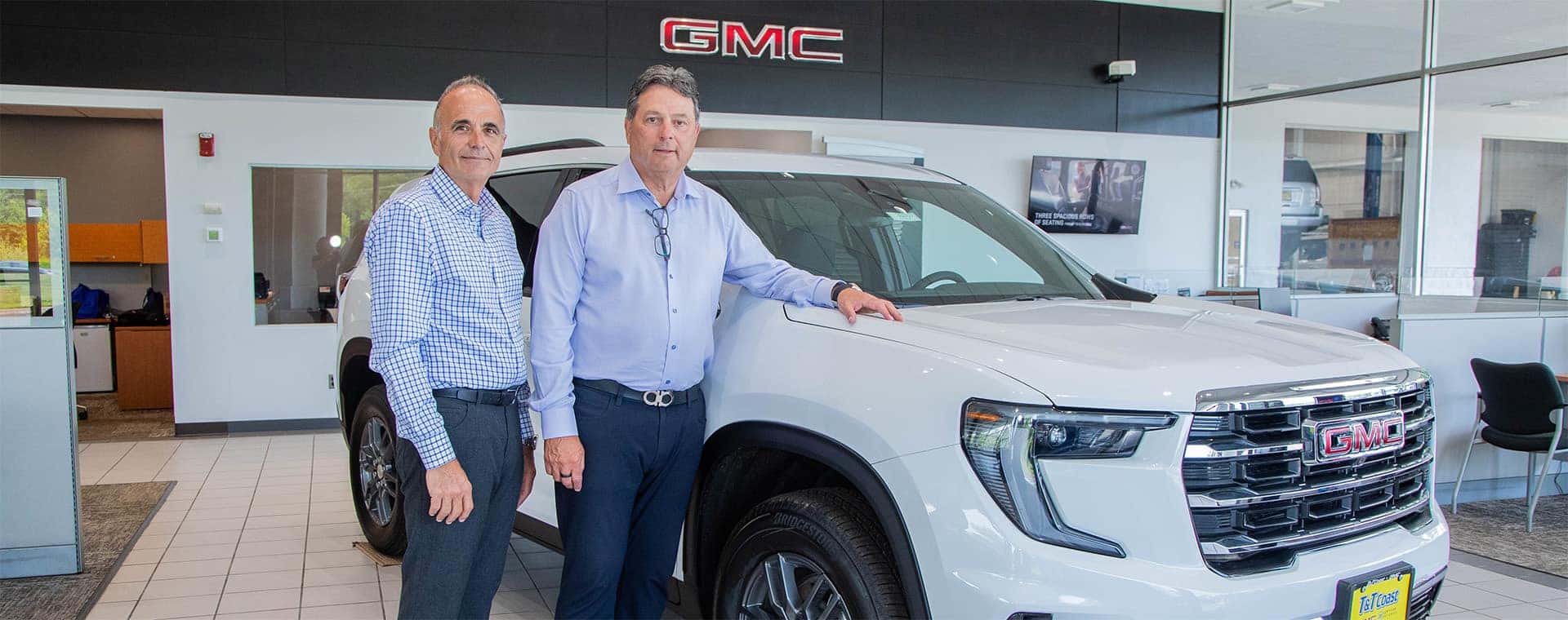 Tim and Tom in the T&T Coast GMC Showroom