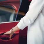 Image of a woman getting into a Mazda vehicle for a blog post for Culver City Mazda about Mazda Maintenance Tips