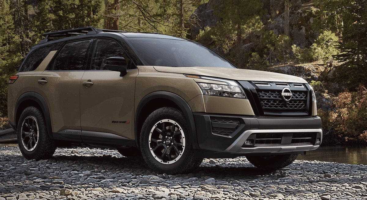 Nissan Pathfinder with trees and leaves in the background