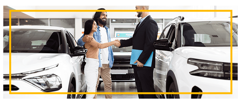 Things to Bring with you to Purchase a Car at Delaney Chevrolet of Indiana in Indiana, PA | Sales person handing over new car keys to customers