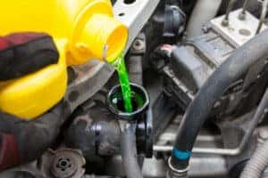 Pouring coolant into a radiator
