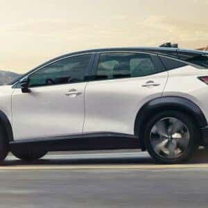 2025 Nissan Ariya Side View on the Road in the Mountains