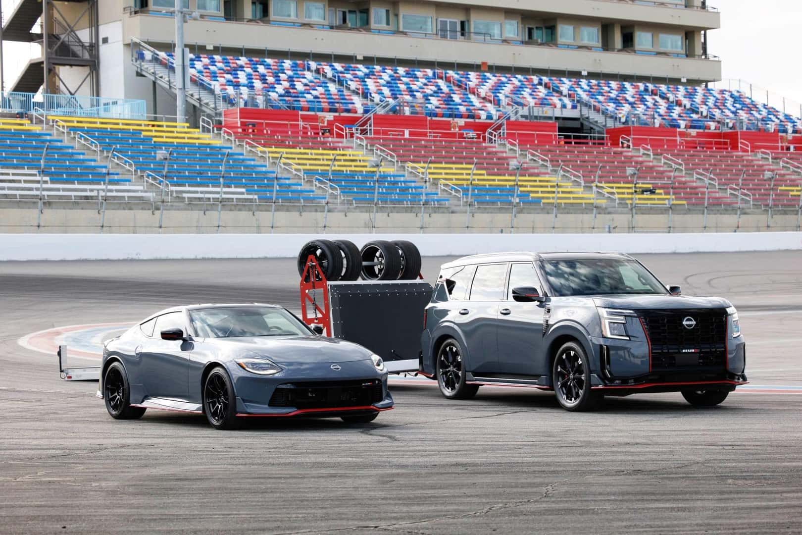 The Nissan Armada NISMO Beside A Racing Car