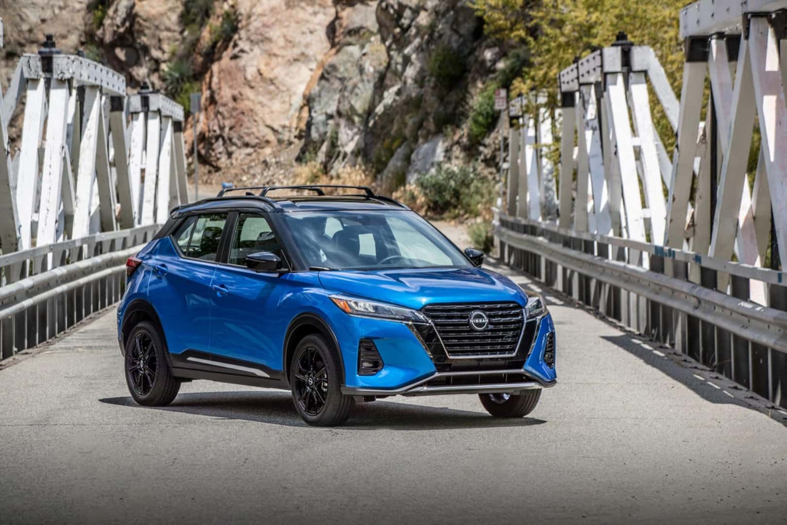 The Fashionable Exterior Of The 2024 Nissan Kicks, Parked On A Bridge