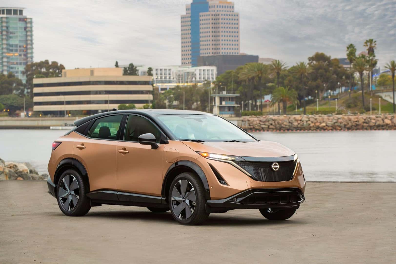 The Gratifying Exterior Of The Nissan Ariya, In A Breezy Coastal City