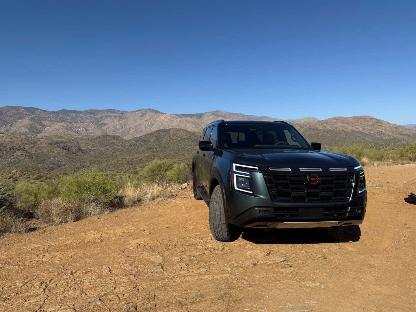 2025 Nissan Armada earned its PRO-4X front end view with mountain view in the background
