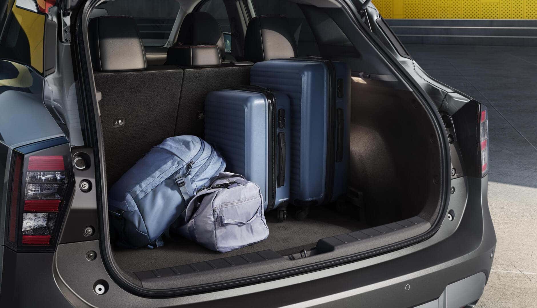 2025 Nissan Kicks cargo area with luggage